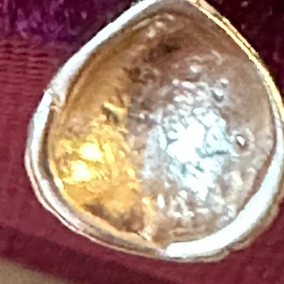 14 karat yellow gold cable ring with a beautiful shell hanging